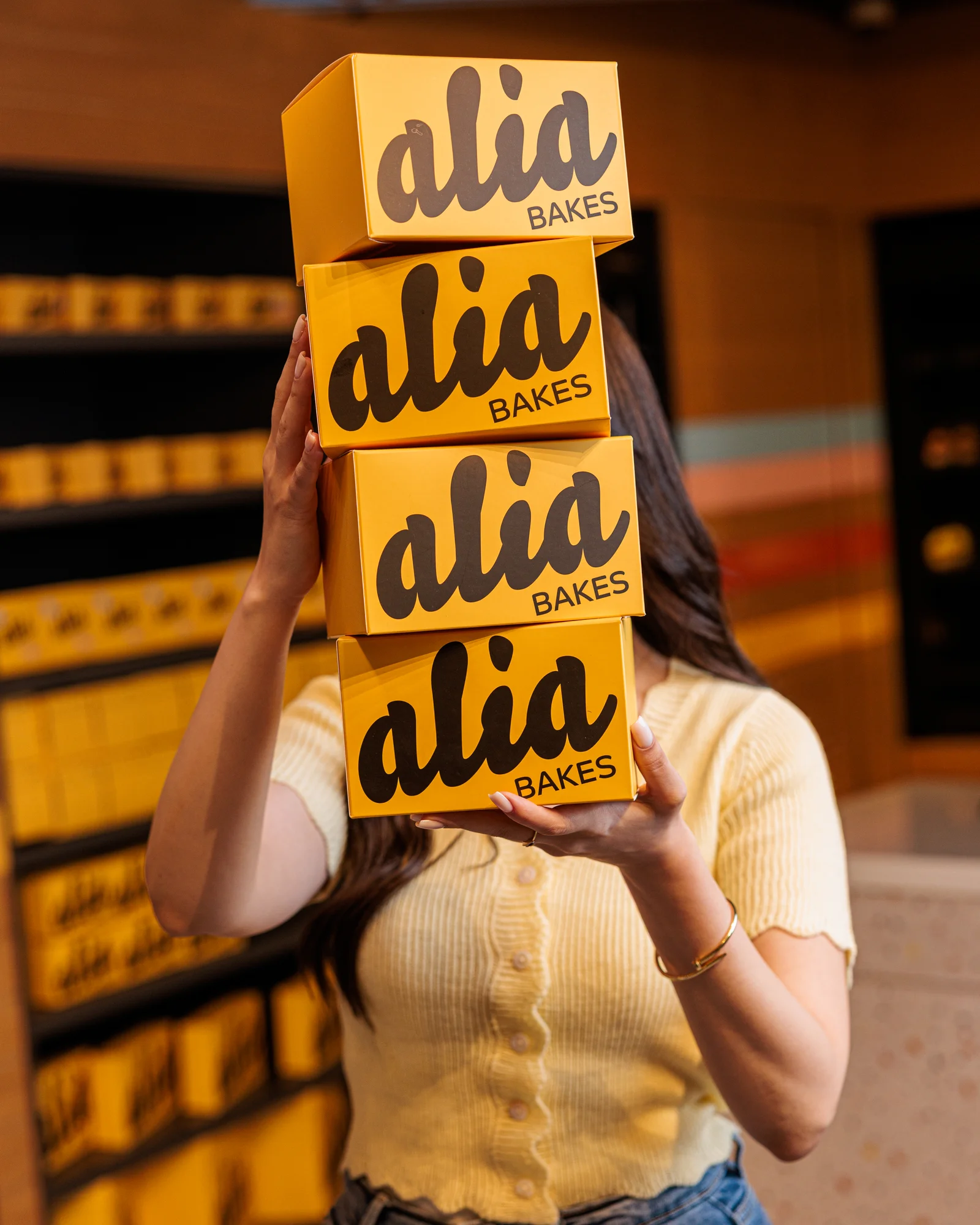 A stack of yellow alia gift boxes